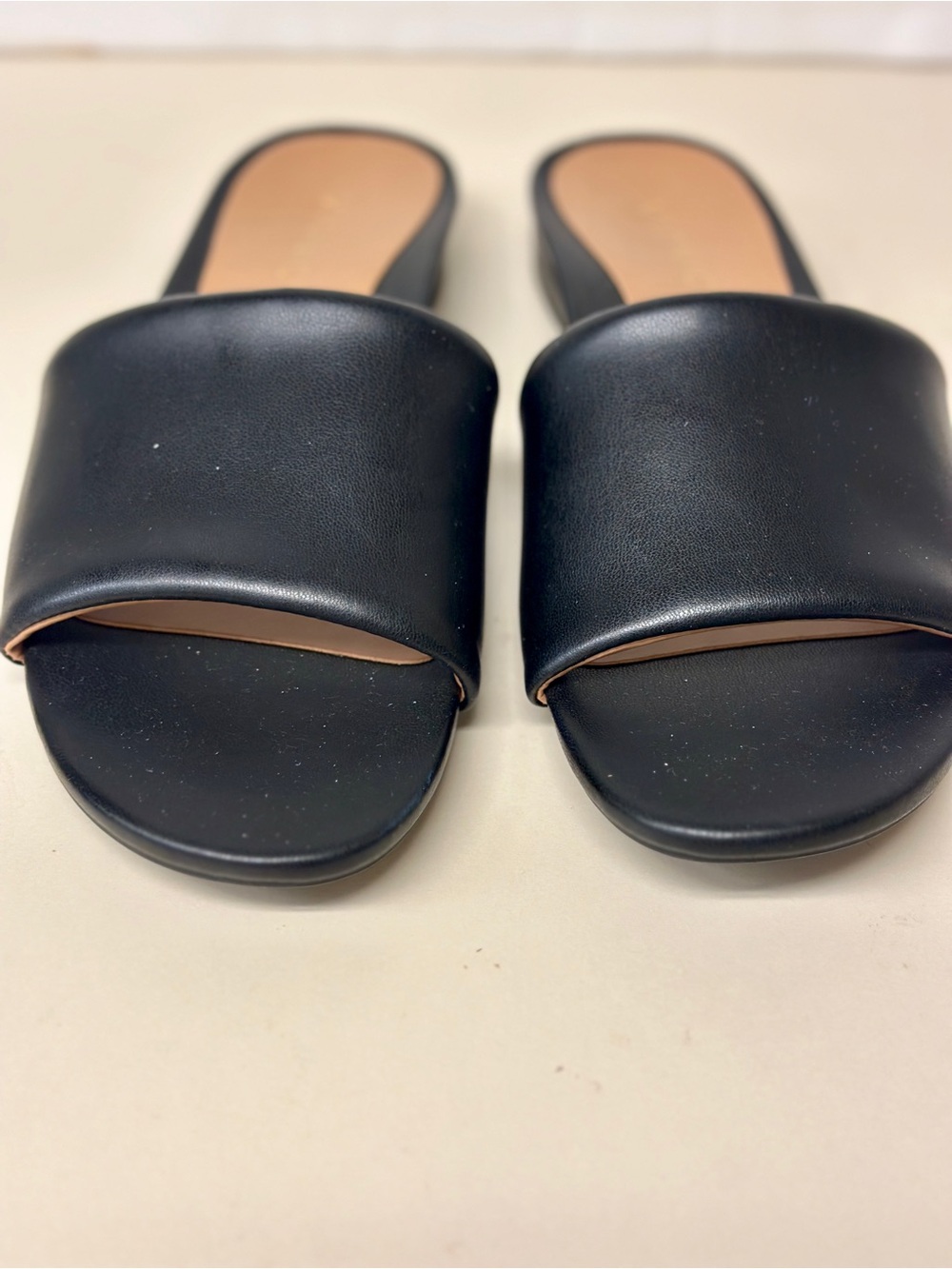 Vionic Black Slide Mules with Tan Insole Trim